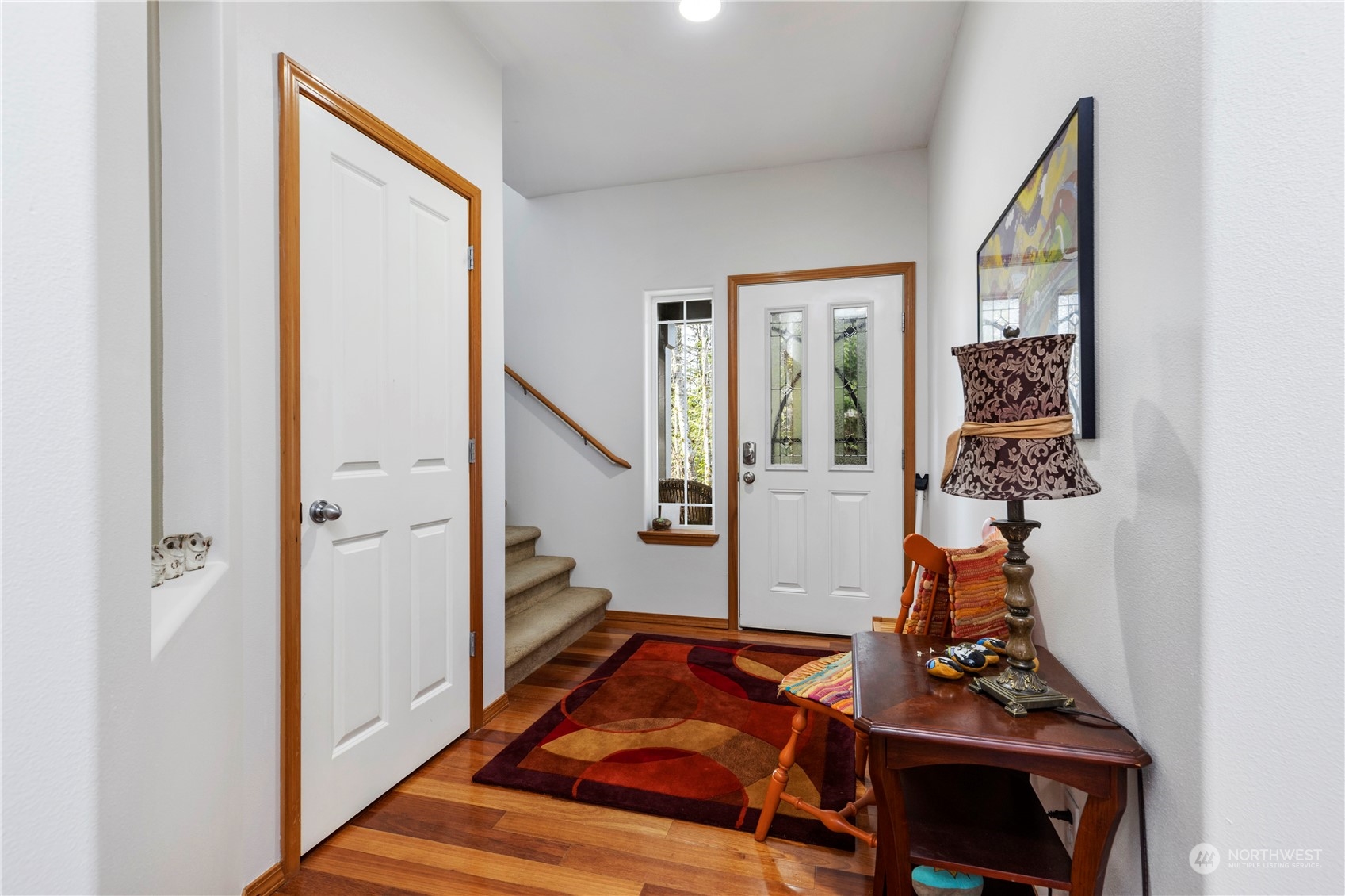 4712 152nd Place Southeast Bothell, WA 98012 - Photo 4 of 31 a view of an entryway with wooden floor