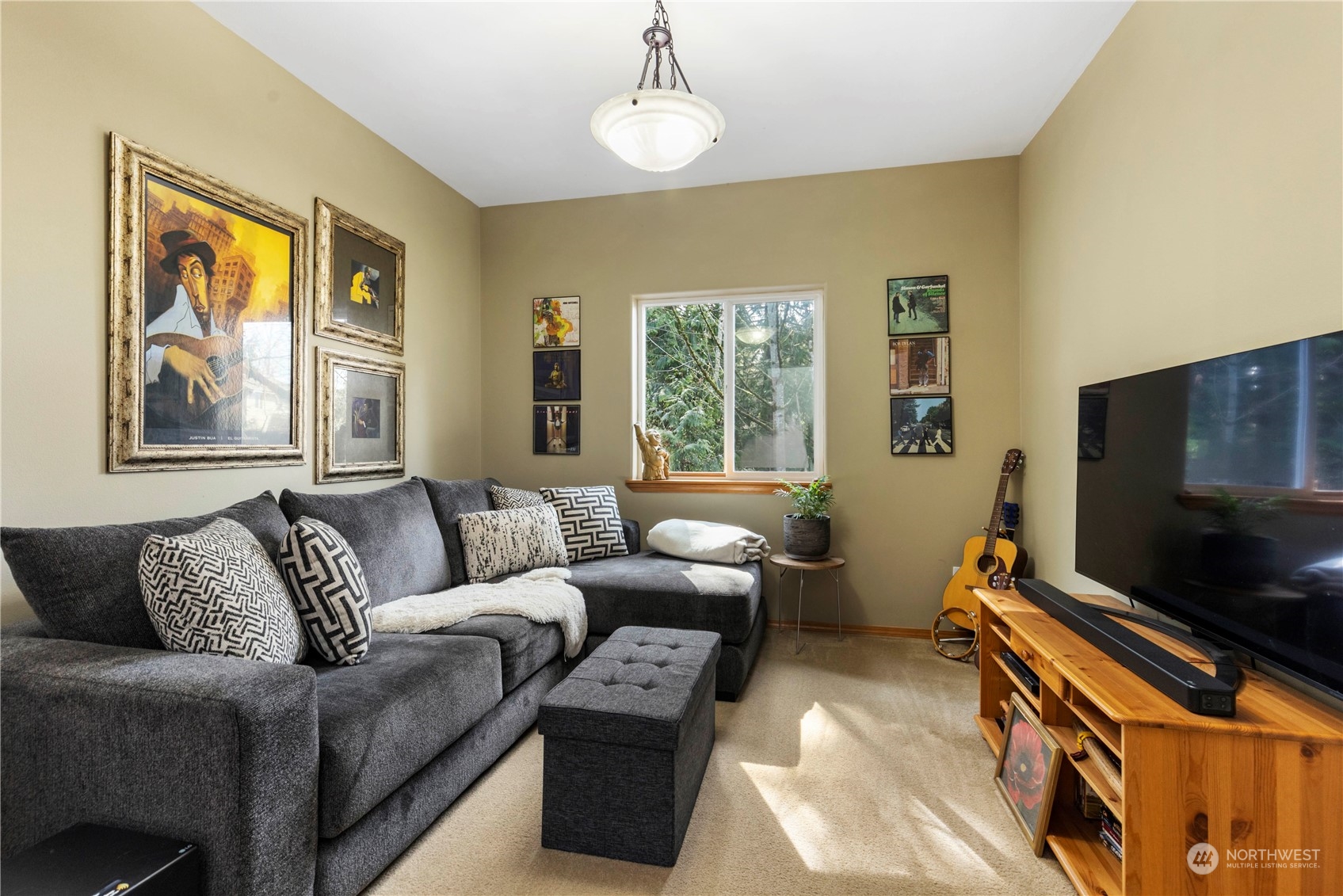 4712 152nd Place Southeast Bothell, WA 98012 - Photo 6 of 31 a living room with furniture and a flat screen tv