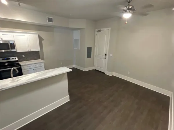 a view of cabinets and wooden floor