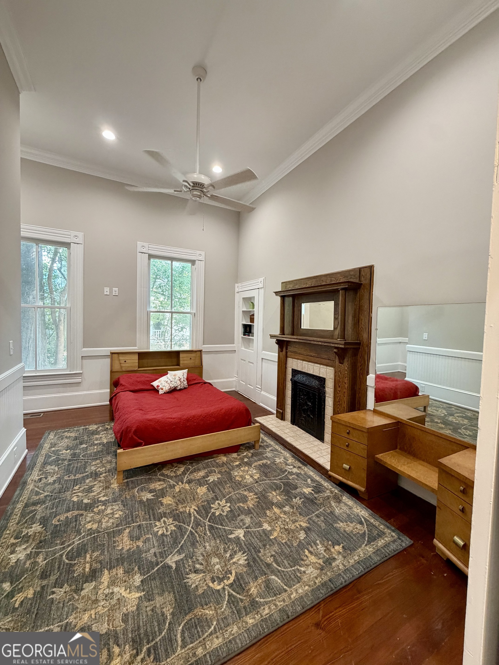 610 North Ridge Avenue Tifton, GA 31794 - Photo 11 of 32 a living room with a fireplace and a flat screen tv