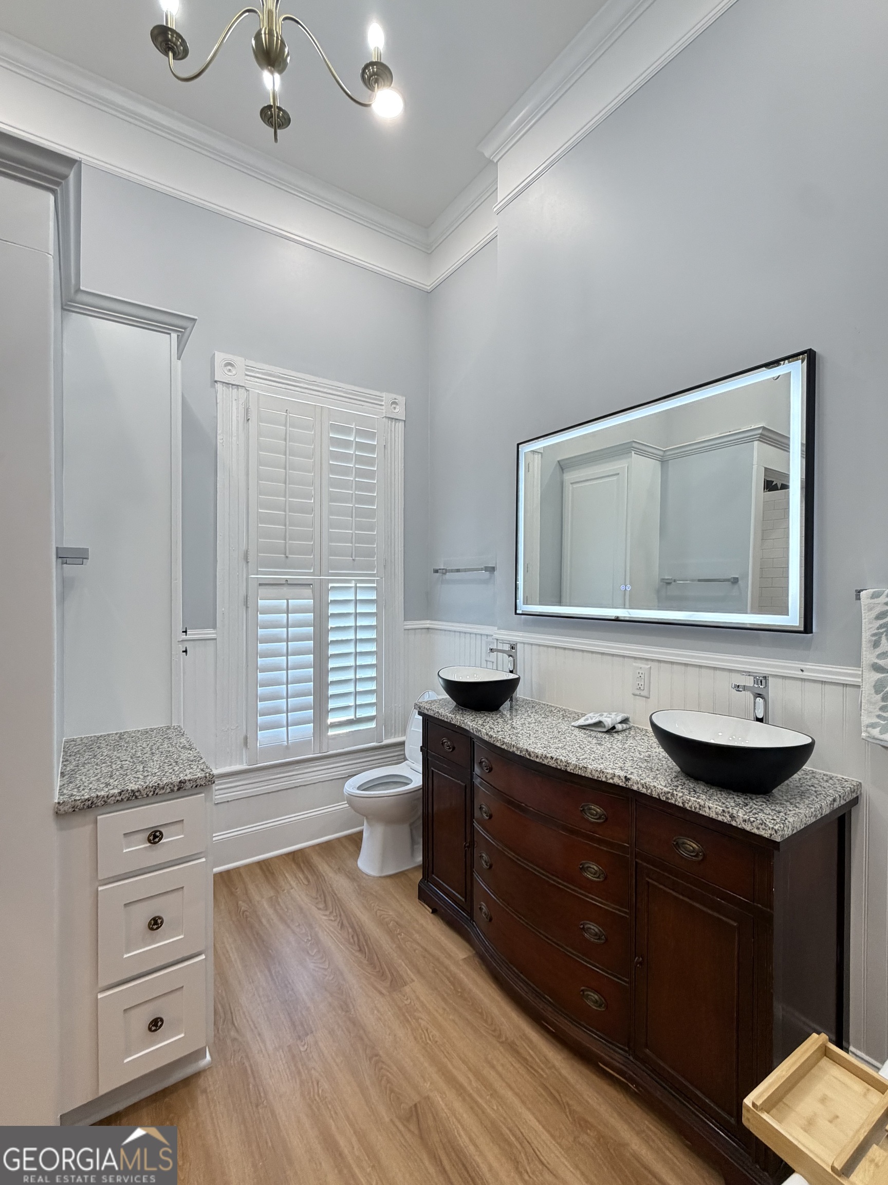 610 North Ridge Avenue Tifton, GA 31794 - Photo 20 of 32 a spacious bathroom with a granite countertop sink and a mirror