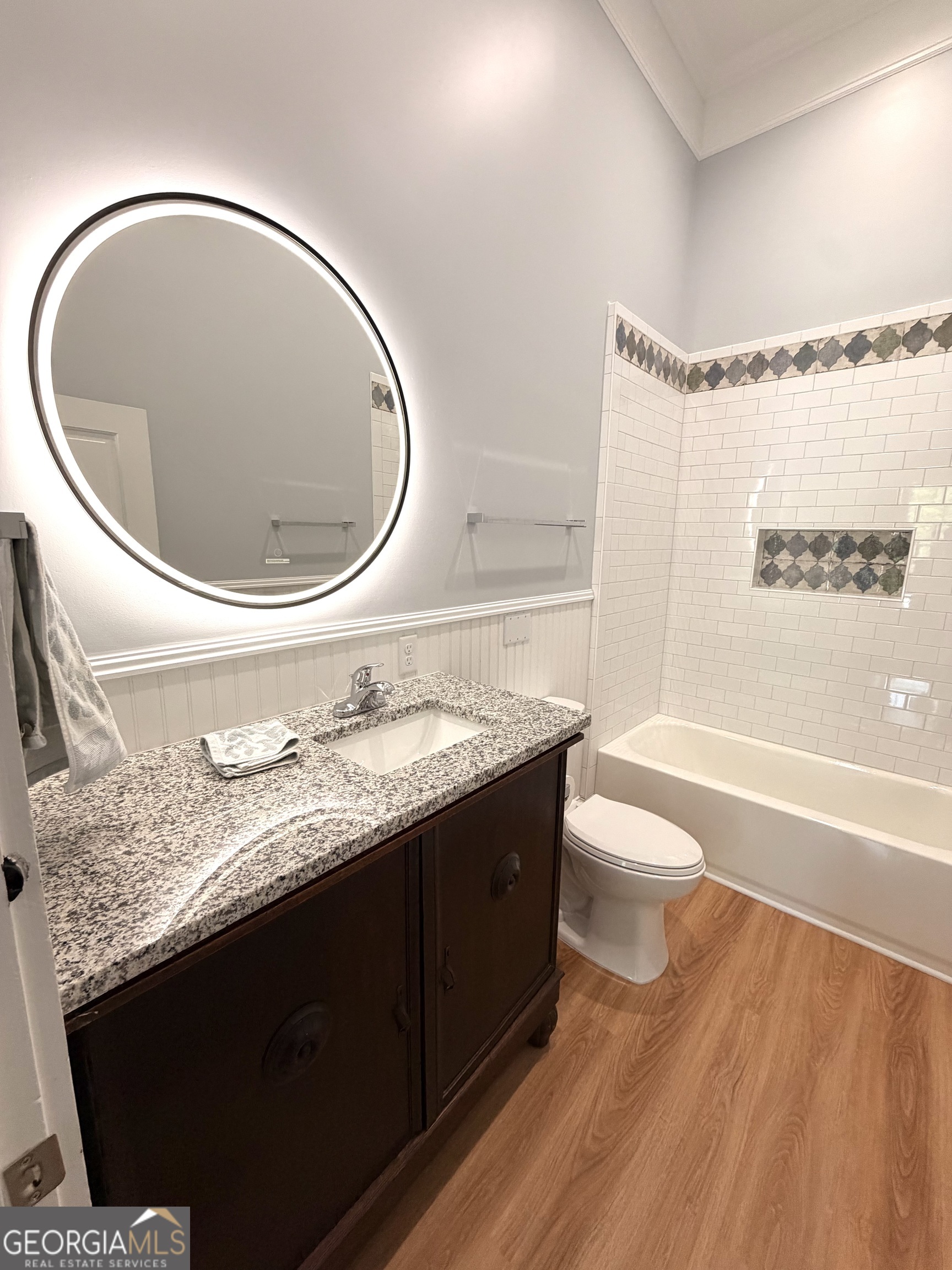 610 North Ridge Avenue Tifton, GA 31794 - Photo 27 of 32 a bathroom with a granite countertop toilet sink and mirror