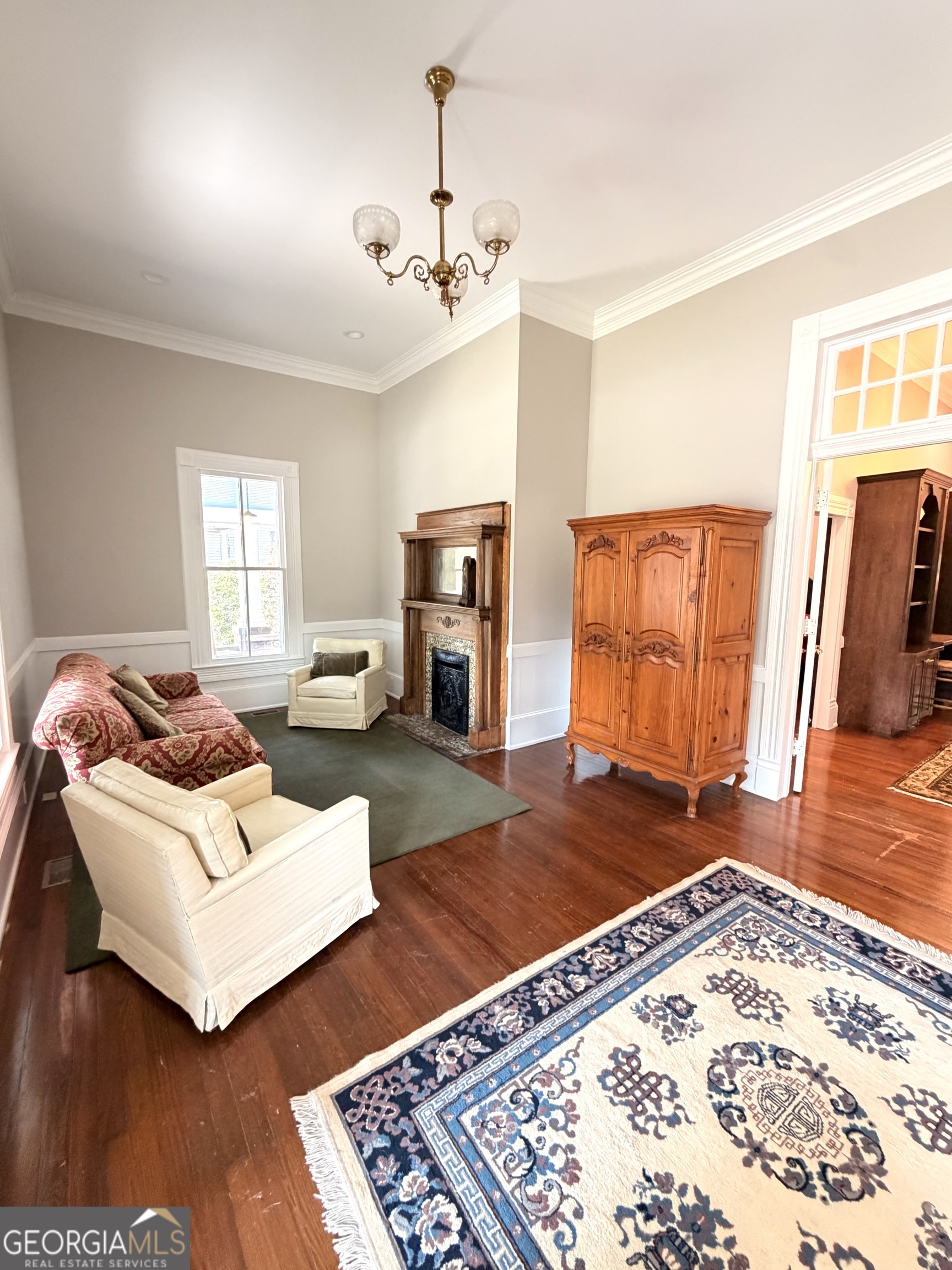 610 North Ridge Avenue Tifton, GA 31794 - Photo 5 of 32 a living room with furniture and a dresser