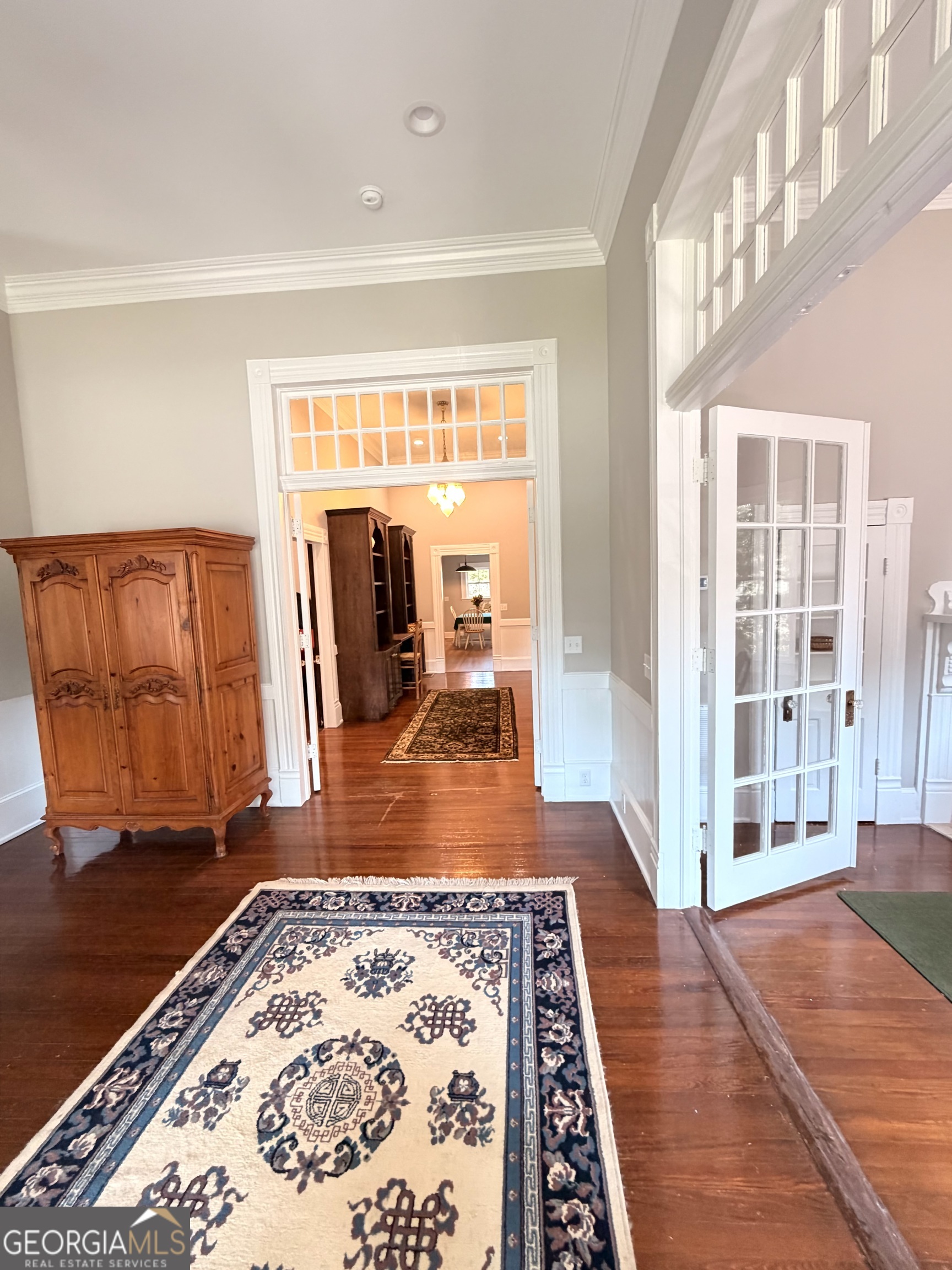 610 North Ridge Avenue Tifton, GA 31794 - Photo 10 of 32 a view of a livingroom with wooden floor and a rug