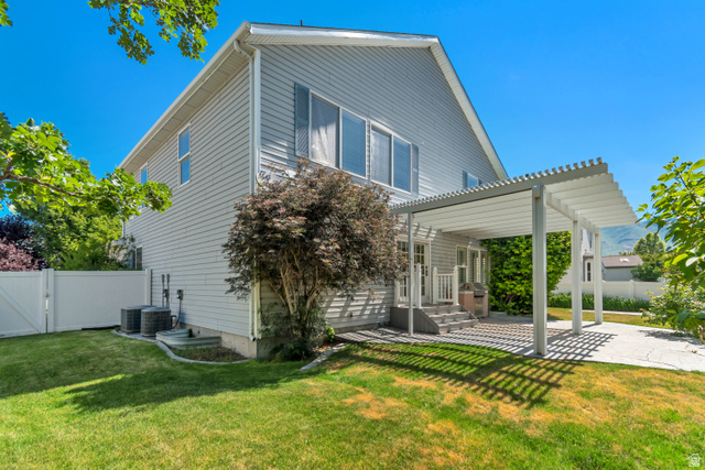 546 Wheatridge Road Tooele, UT 84074 - Photo 6 of 49 Two-story exterior with light gray siding and white trim