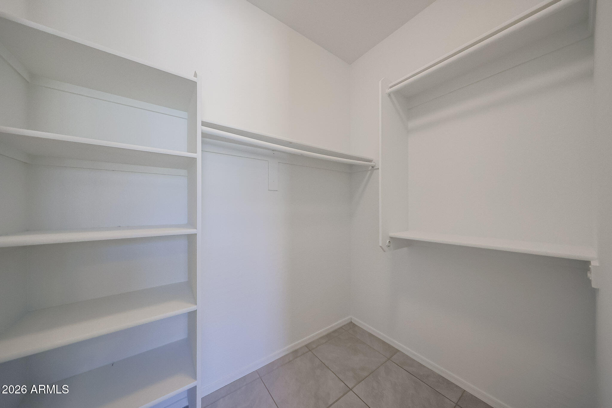 17592 West Hadley Street Goodyear, AZ 85338 - Photo 11 of 20 a view of an empty walk in closet