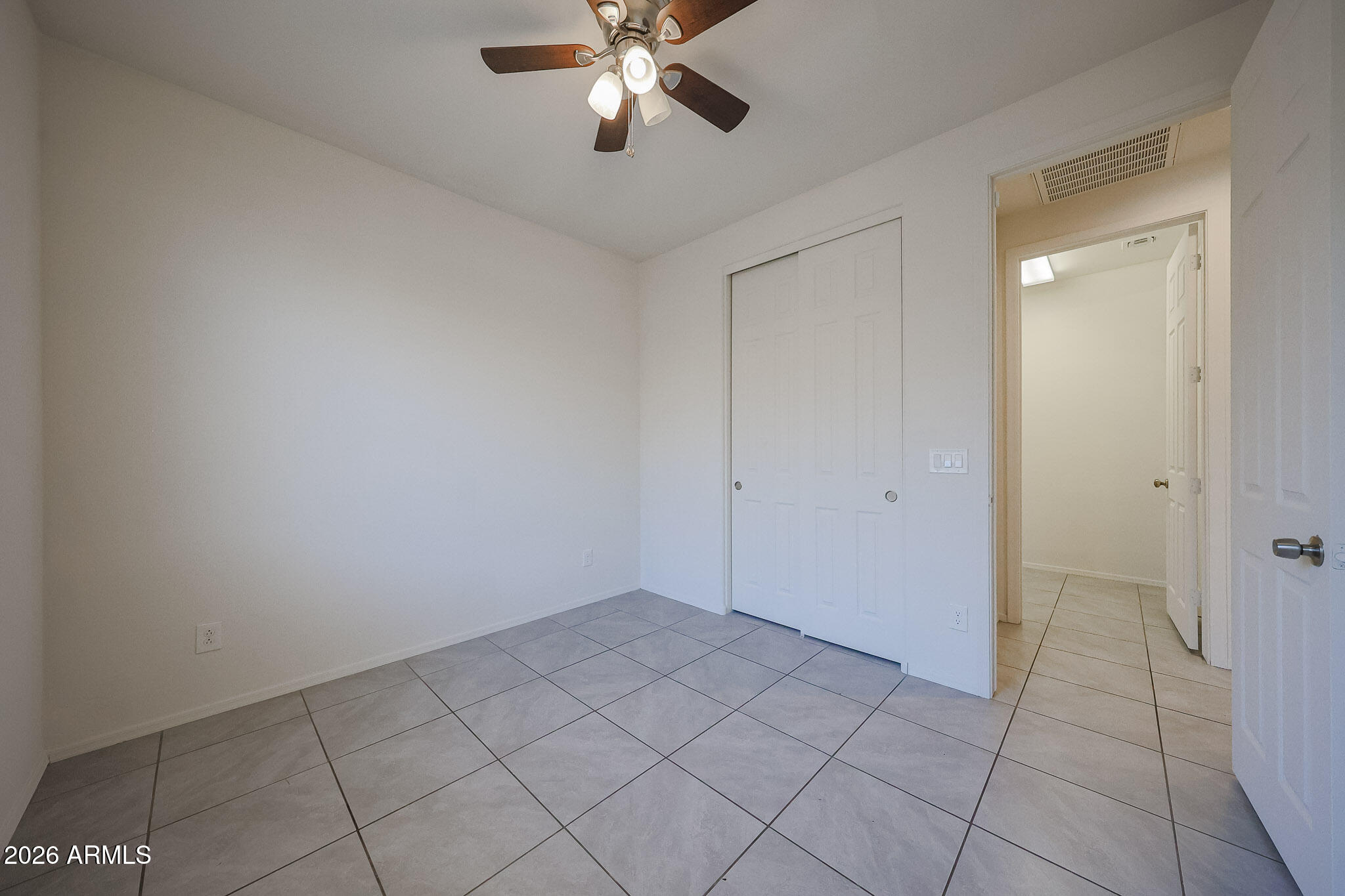 17592 West Hadley Street Goodyear, AZ 85338 - Photo 14 of 20 a view of an empty room and chandelier fan