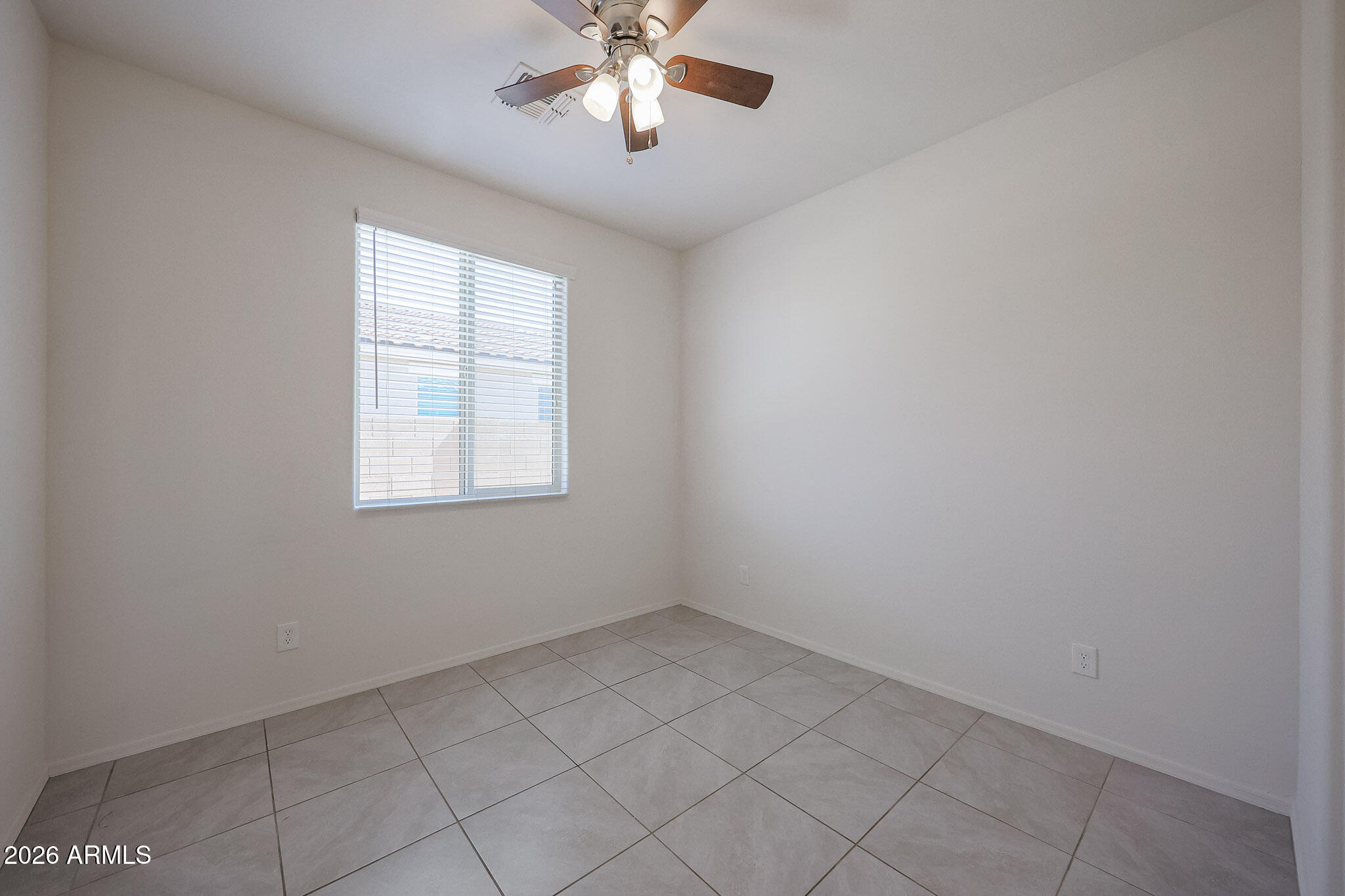 17592 West Hadley Street Goodyear, AZ 85338 - Photo 16 of 20 an empty room with a window