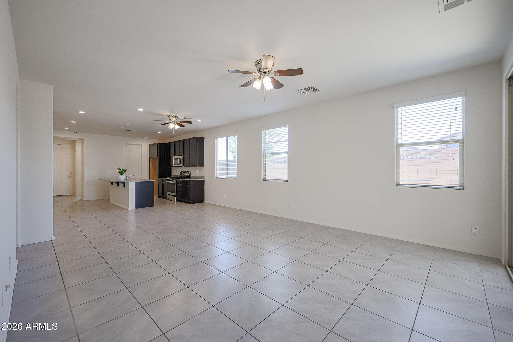 17592 West Hadley Street Goodyear, AZ 85338 - Photo 6 of 20 a view of empty room with a kitchen