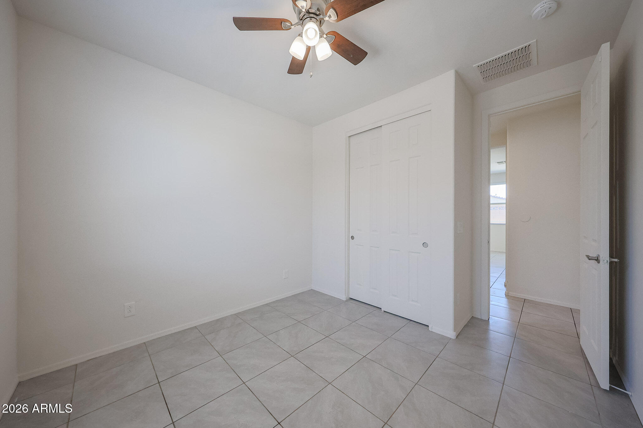 17592 West Hadley Street Goodyear, AZ 85338 - Photo 7 of 20 a view of an empty room and chandelier fan