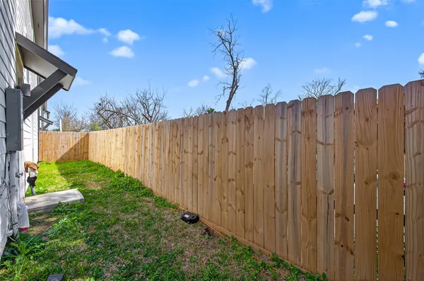a view of a backyard with potted plants