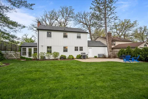 a view of a yard with a house in the background