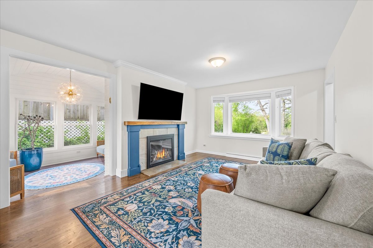 1541 Wilmot Road Deerfield, IL 60015 - Photo 5 of 25 a living room with furniture and a fireplace