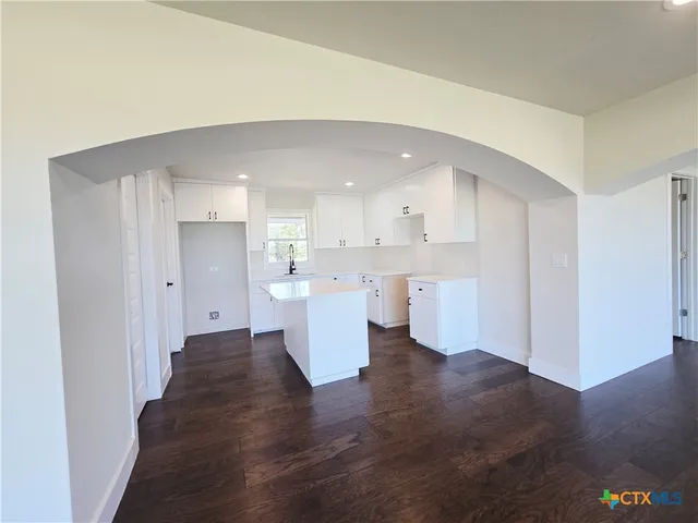 a view of kitchen with wooden floor