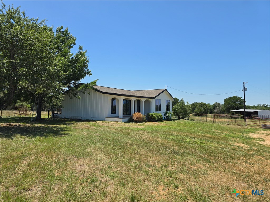 930 Elm Creek Road Rockdale, TX 76567 - Photo 2 of 25 a front view of a house with a yard