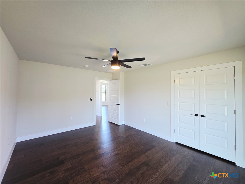 930 Elm Creek Road Rockdale, TX 76567 - Photo 8 of 25 a view of an empty room with wooden floor