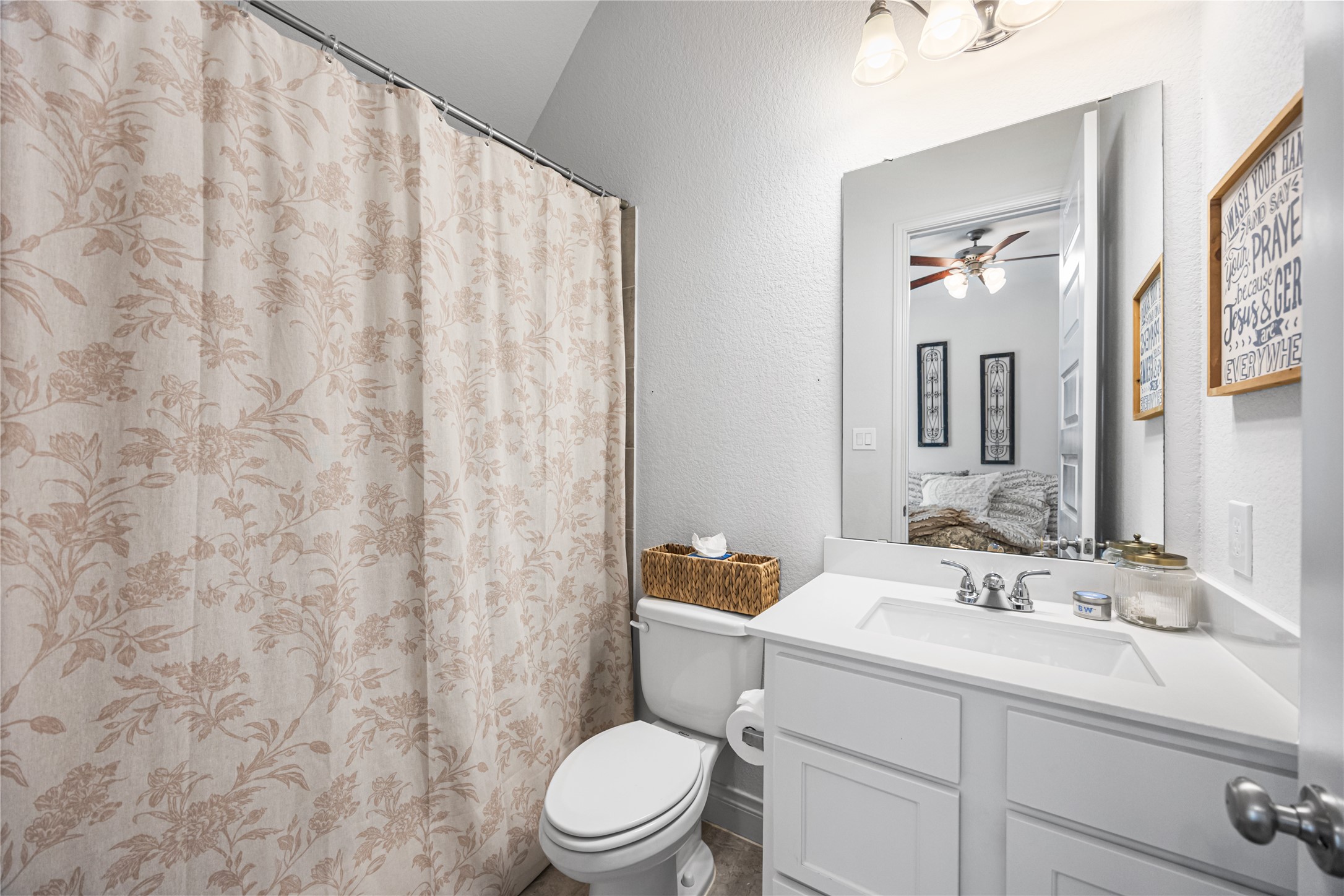 28169 Knight Peak Drive Spring, TX 77386 - Photo 20 of 33 a bathroom with a granite countertop sink mirror vanity and toilet
