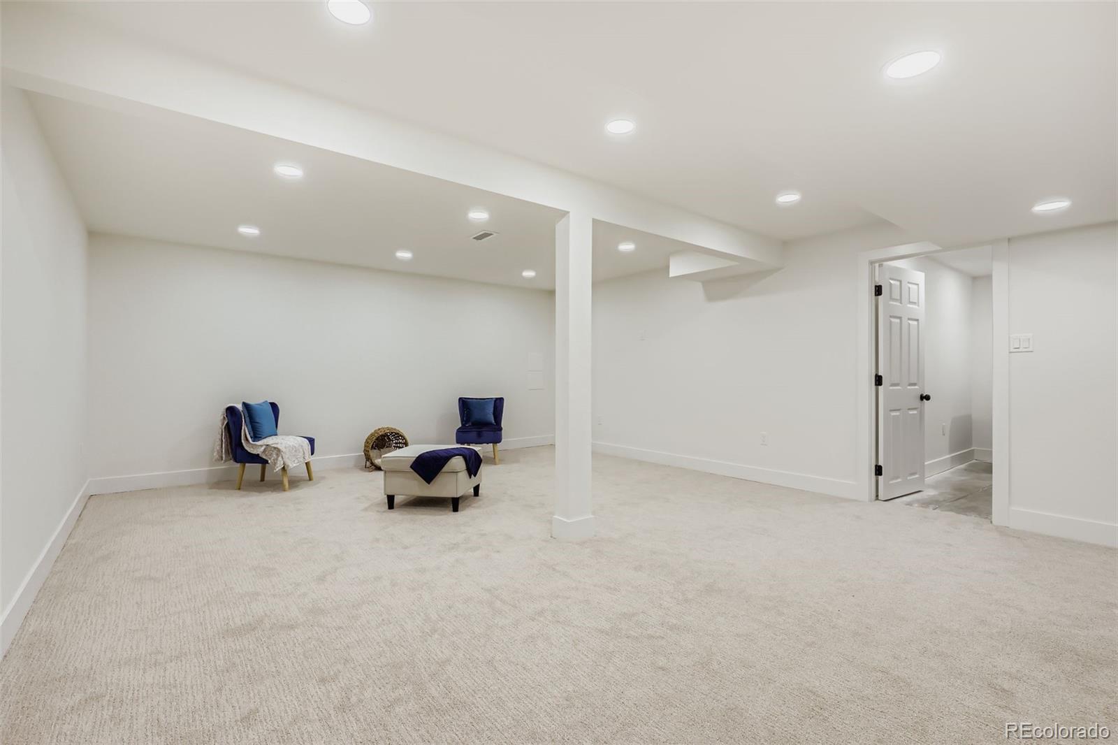 4465 Durham Court Denver, CO 80239 - Photo 19 of 28 a room with furniture and a ceiling fan