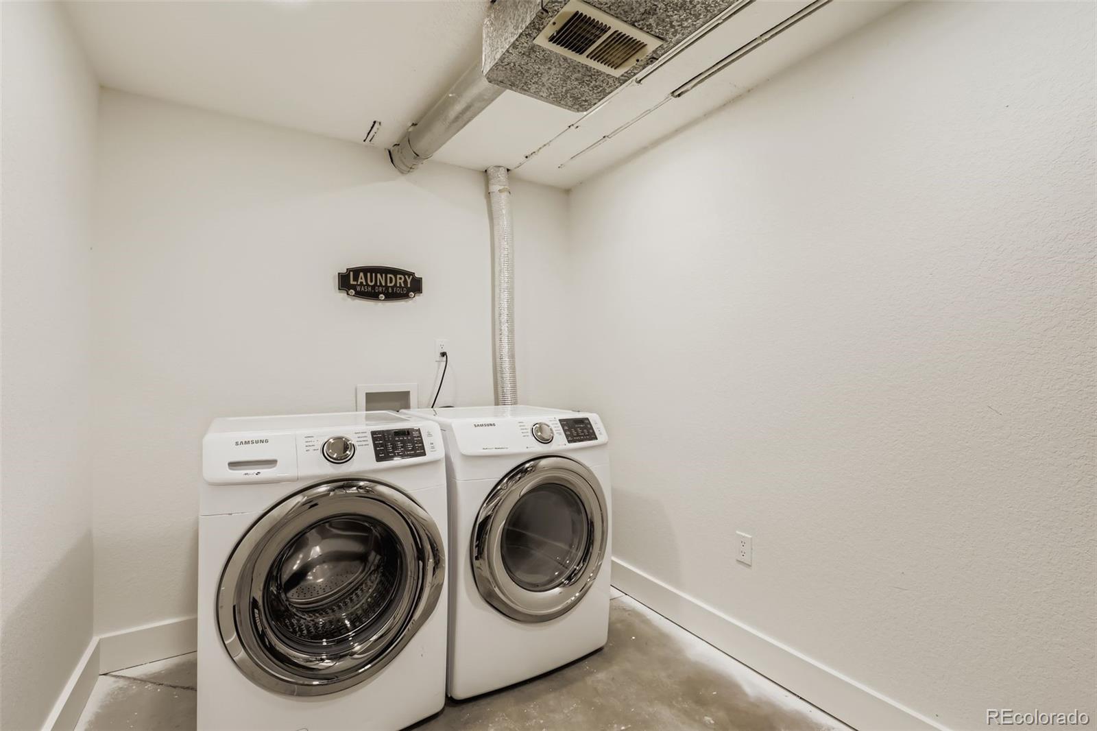 4465 Durham Court Denver, CO 80239 - Photo 25 of 28 a utility room with dryer and washer