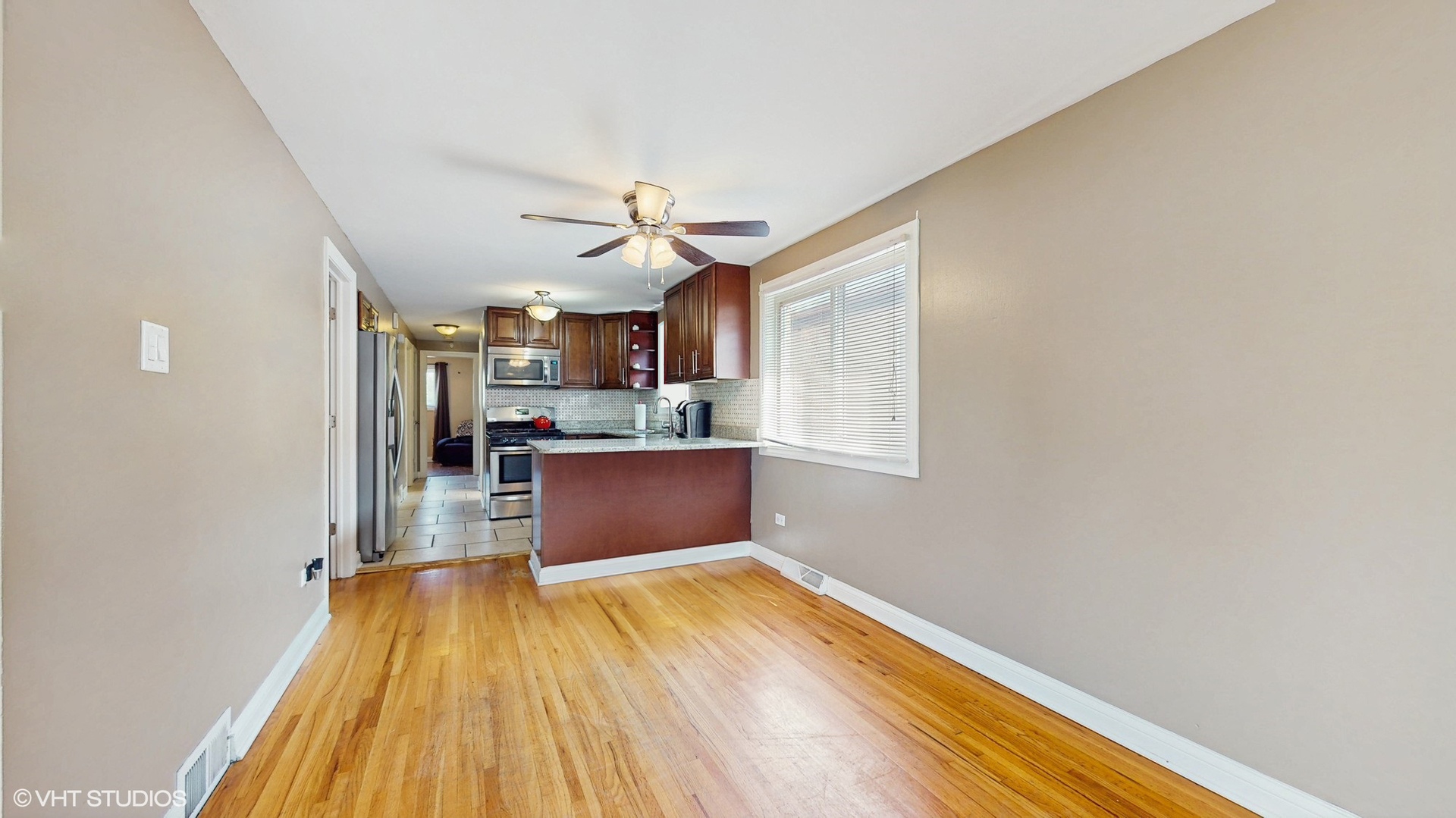 3052 East 97th Street Chicago, IL 60617 - Photo 4 of 19 a view of kitchen and wooden floor