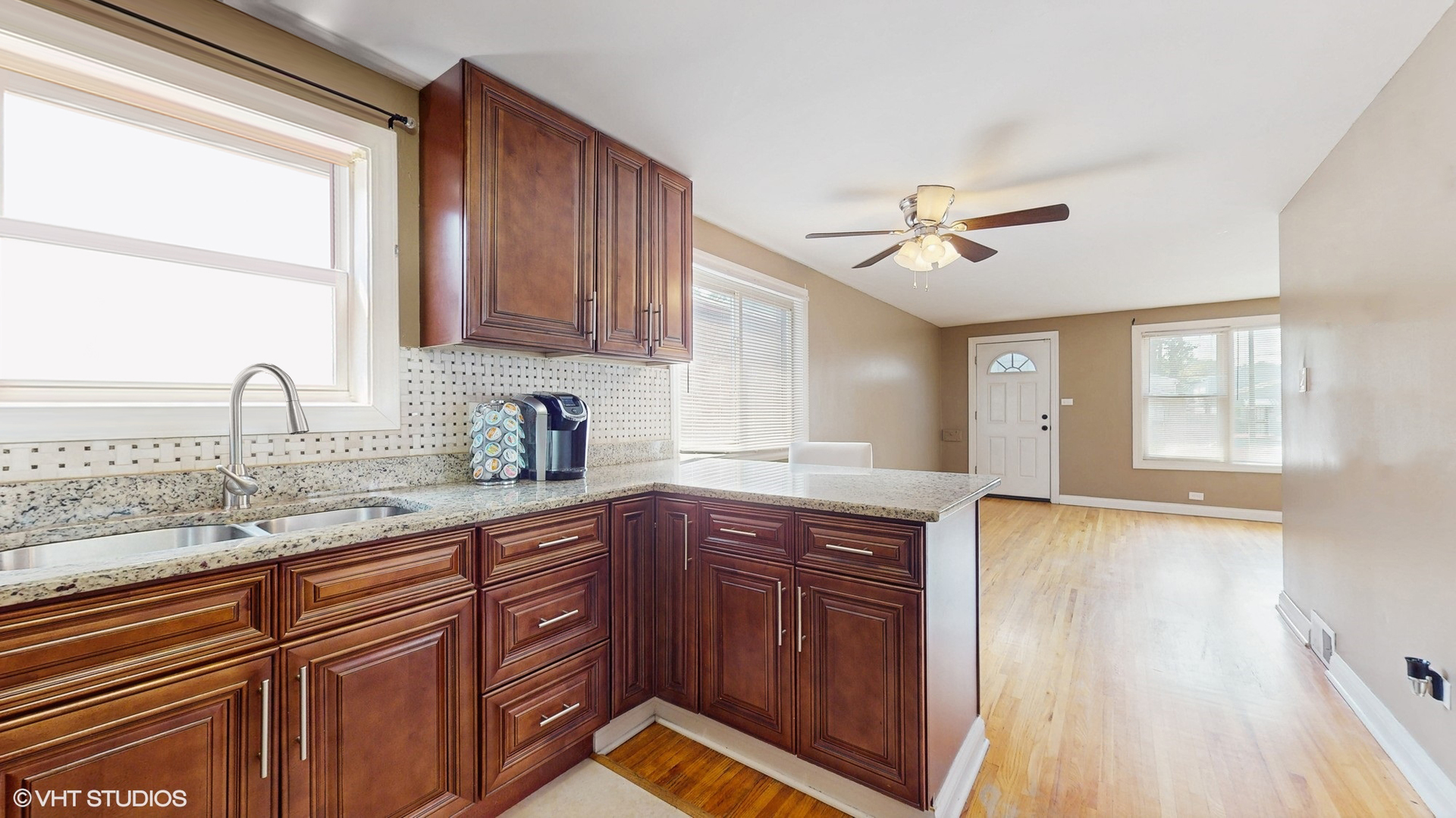 3052 East 97th Street Chicago, IL 60617 - Photo 6 of 19 a kitchen with stainless steel appliances granite countertop a sink stove and cabinets