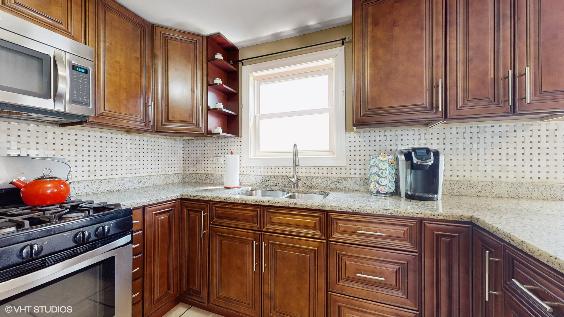 3052 East 97th Street Chicago, IL 60617 - Photo 8 of 19 a kitchen with stainless steel appliances granite countertop a sink stove and cabinets