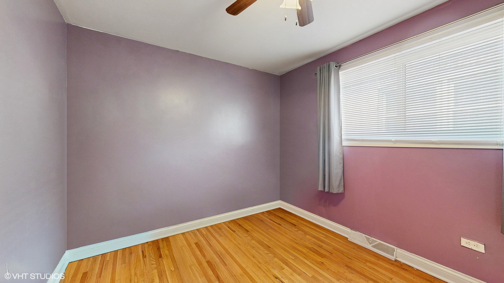 3052 East 97th Street Chicago, IL 60617 - Photo 10 of 19 a view of a room with wooden floor and fan
