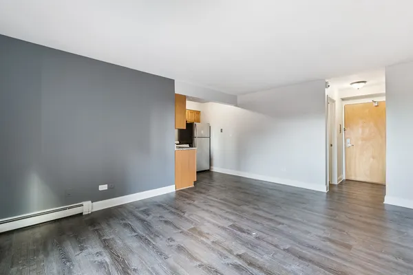 a view of a livingroom with wooden floor