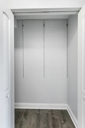 a picture of a bench in front of a wall