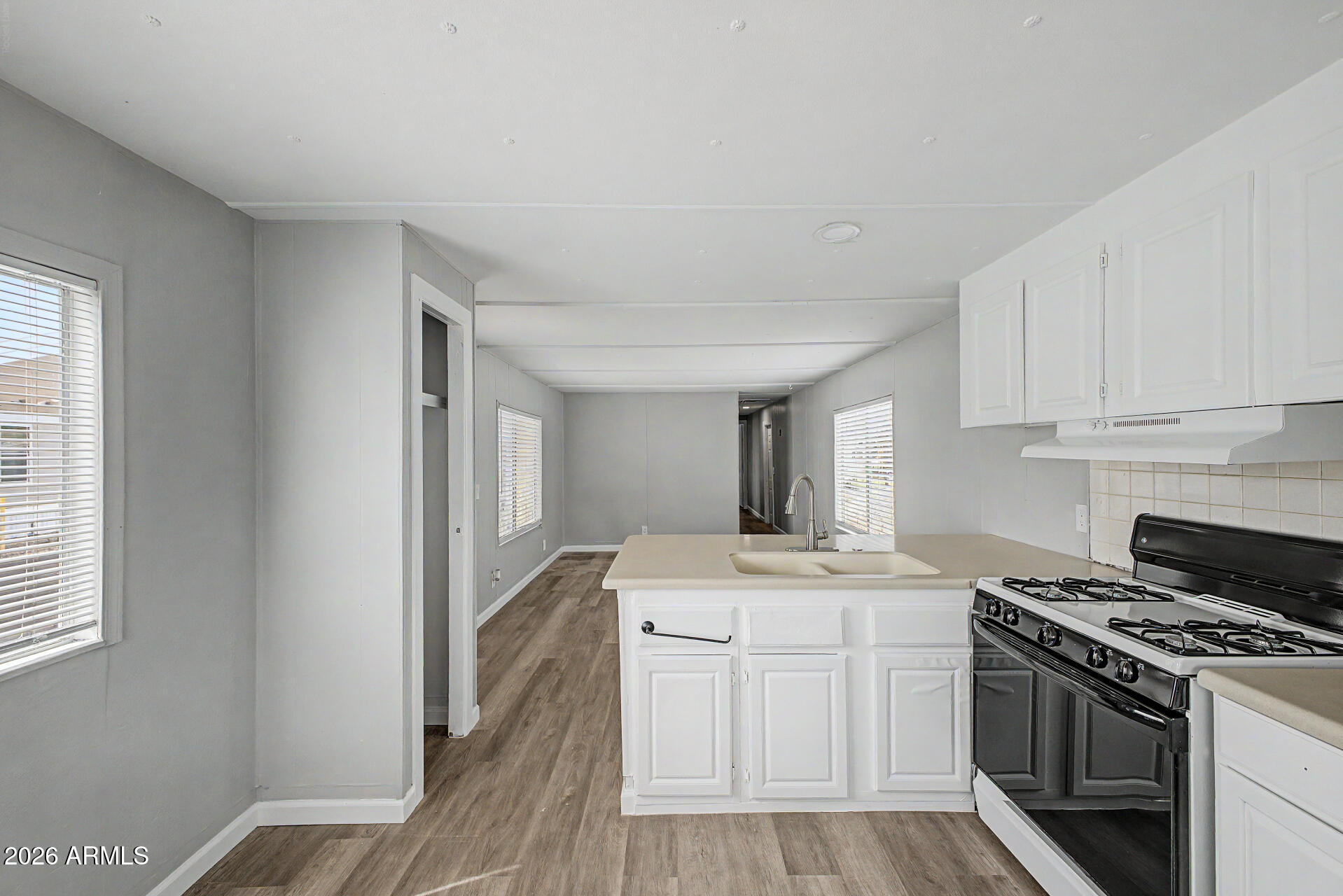 555 West Warner Road, Unit 45 Chandler, AZ 85225 - Photo 12 of 22 a kitchen with a sink stove and cabinets