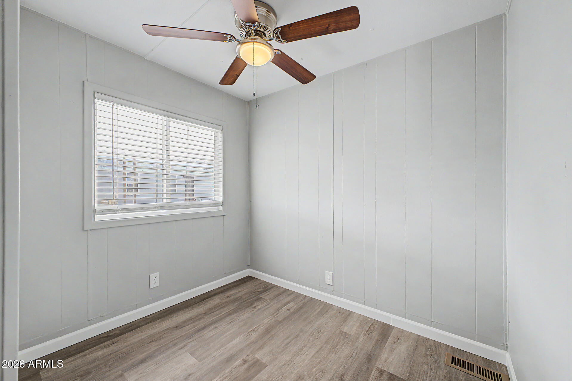 555 West Warner Road, Unit 45 Chandler, AZ 85225 - Photo 17 of 22 an empty room with windows and fan