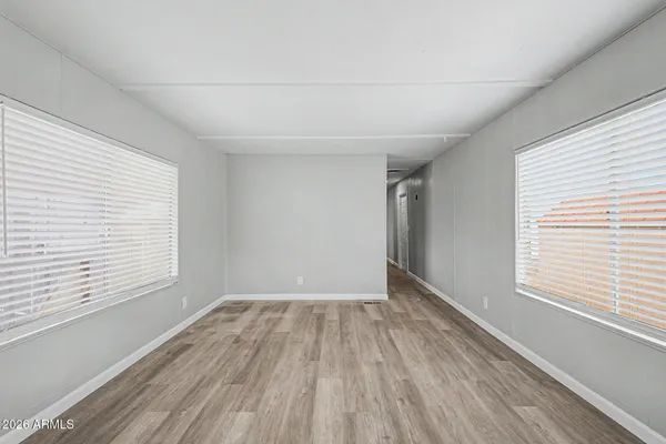a view of kitchen and wooden floor