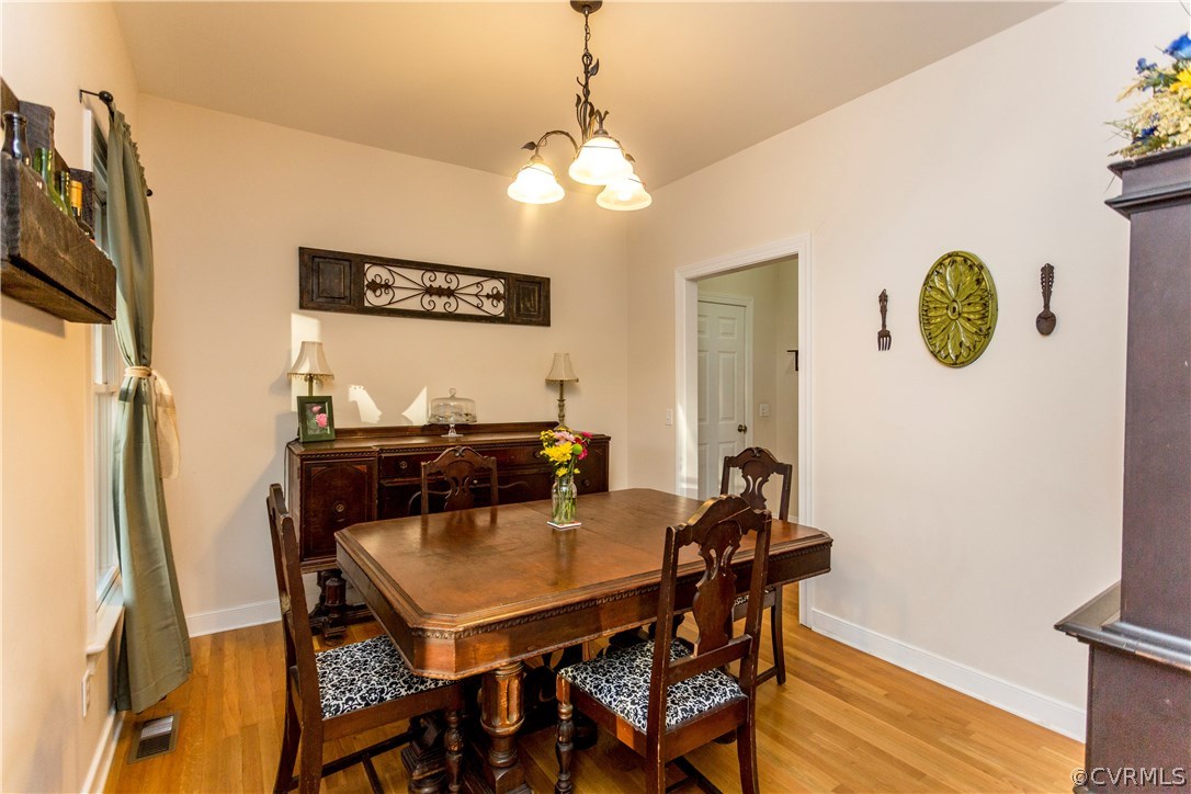 10201 Taylor Road Chesterfield, VA 23838 - Photo 12 of 50 a view of a dining room with furniture and wooden floor