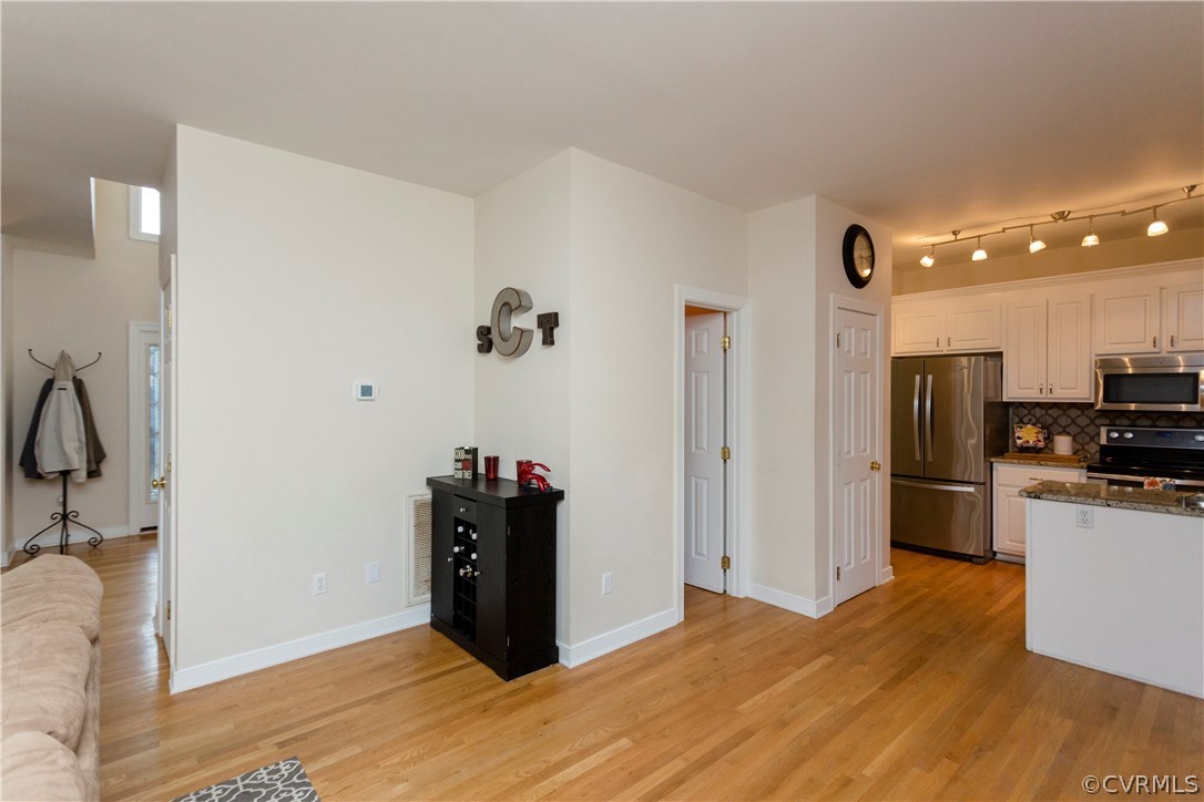 10201 Taylor Road Chesterfield, VA 23838 - Photo 21 of 50 a view of a kitchen with refrigerator and wooden floor