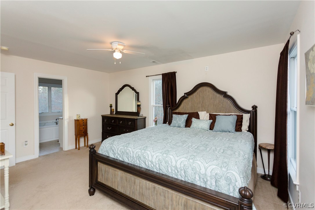 10201 Taylor Road Chesterfield, VA 23838 - Photo 25 of 50 a bedroom with a bed and a dresser with mirror