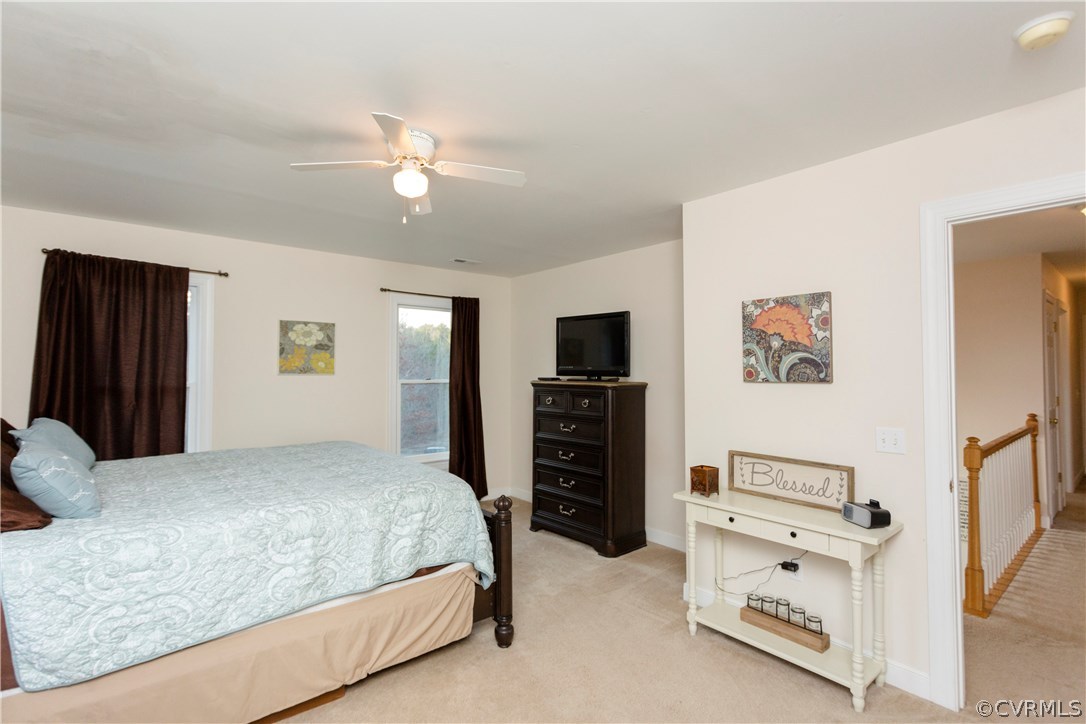 10201 Taylor Road Chesterfield, VA 23838 - Photo 26 of 50 a bedroom with a bed and a flat tv screen on dresser