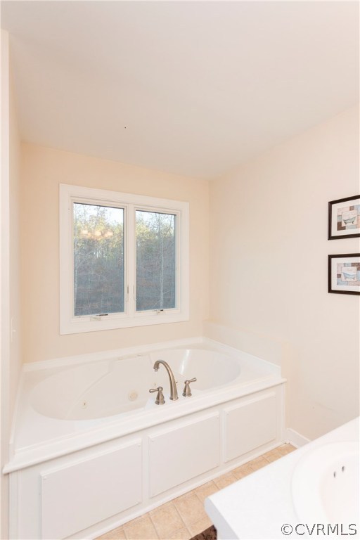 10201 Taylor Road Chesterfield, VA 23838 - Photo 29 of 50 a bathroom with a bathtub and a window