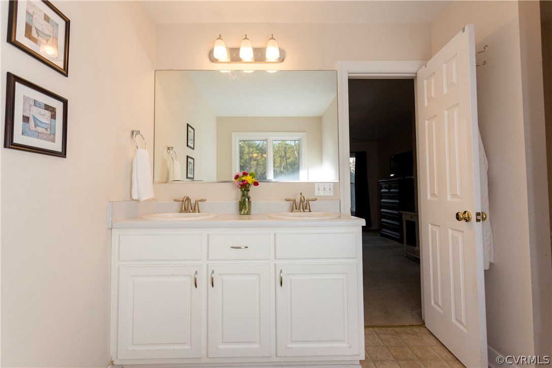 10201 Taylor Road Chesterfield, VA 23838 - Photo 30 of 50 a bathroom with a sink vanity and a mirror