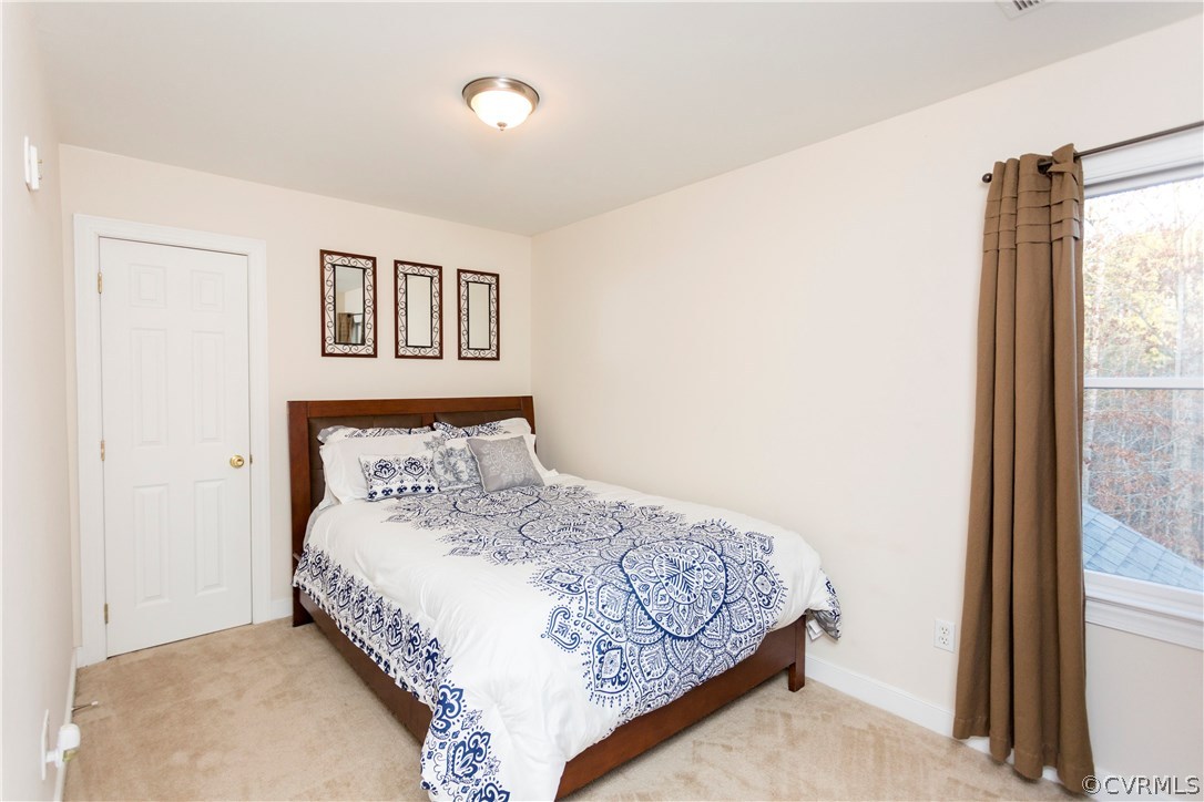 10201 Taylor Road Chesterfield, VA 23838 - Photo 31 of 50 a bedroom with a bed and a window