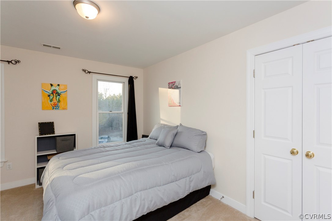 10201 Taylor Road Chesterfield, VA 23838 - Photo 34 of 50 a bedroom with a bed and painting on the wall