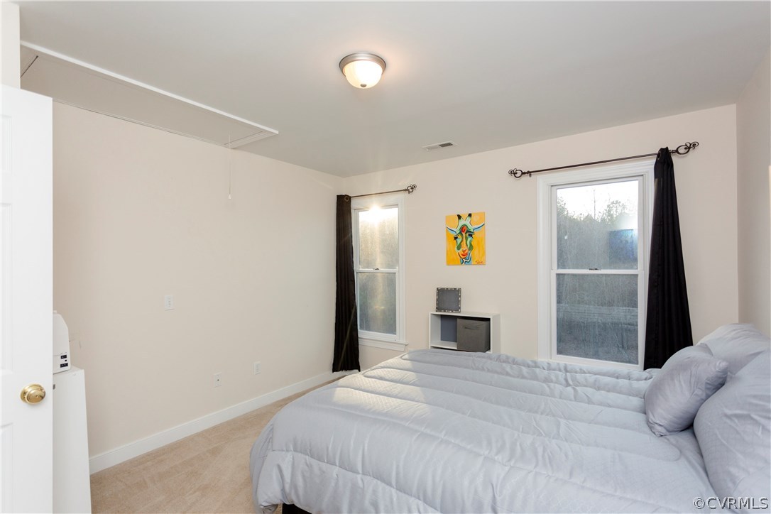 10201 Taylor Road Chesterfield, VA 23838 - Photo 35 of 50 a bedroom with a bed and glass door