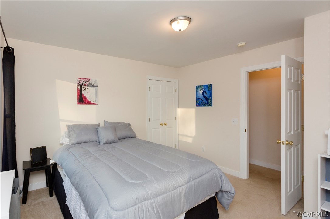 10201 Taylor Road Chesterfield, VA 23838 - Photo 36 of 50 a bedroom with a bed and a table