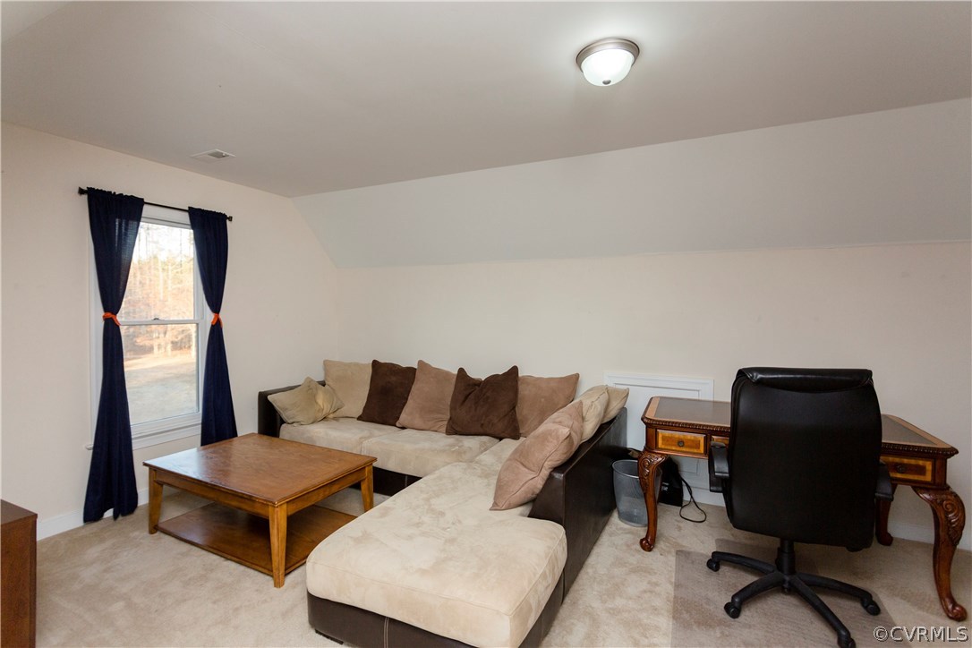 10201 Taylor Road Chesterfield, VA 23838 - Photo 37 of 50 a living room with furniture and a chair