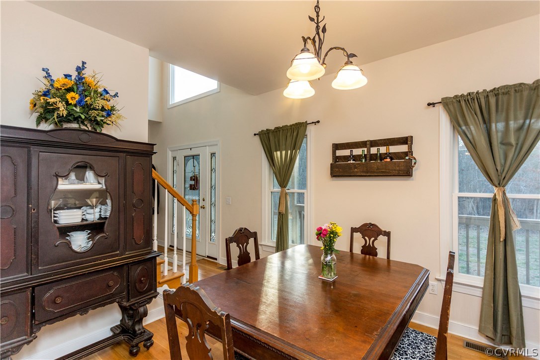 10201 Taylor Road Chesterfield, VA 23838 - Photo 9 of 50 a view of a dining room with furniture and a chandelier