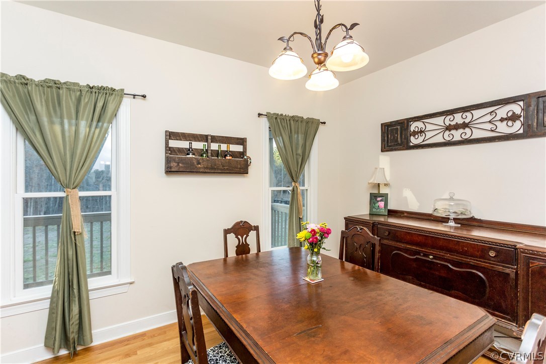 10201 Taylor Road Chesterfield, VA 23838 - Photo 10 of 50 a view of a dining room with furniture and a chandelier