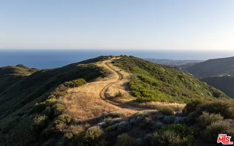 a view of ocean and mountain