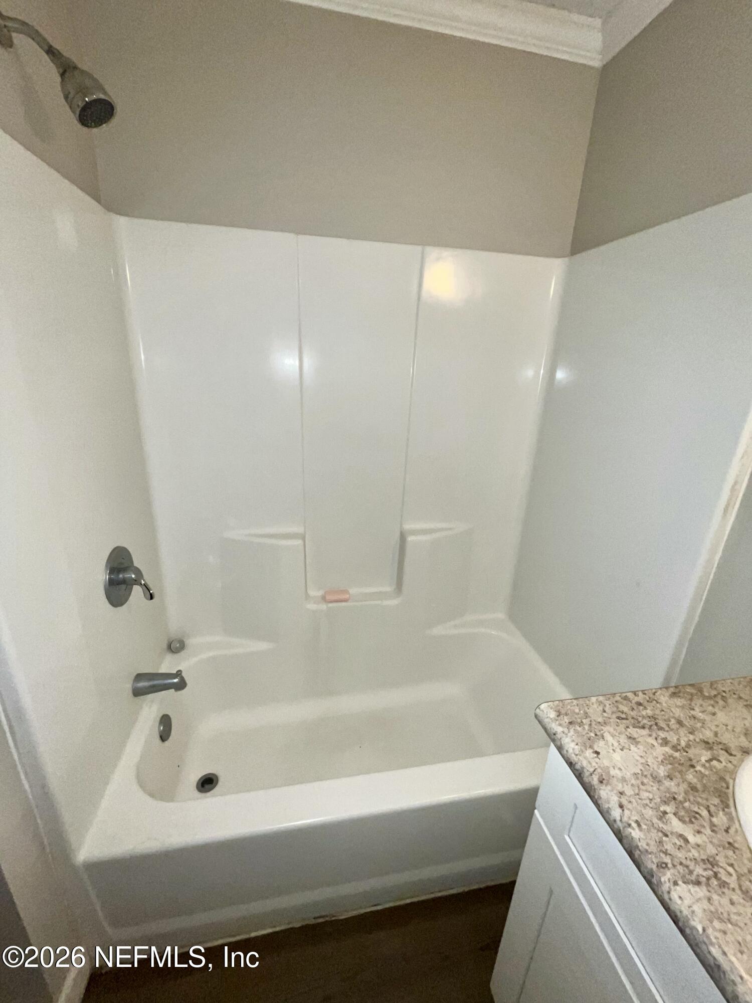 2017 Talladega Road Jacksonville, FL 32209 - Photo 25 of 34 a bath tub sitting next to a white sink