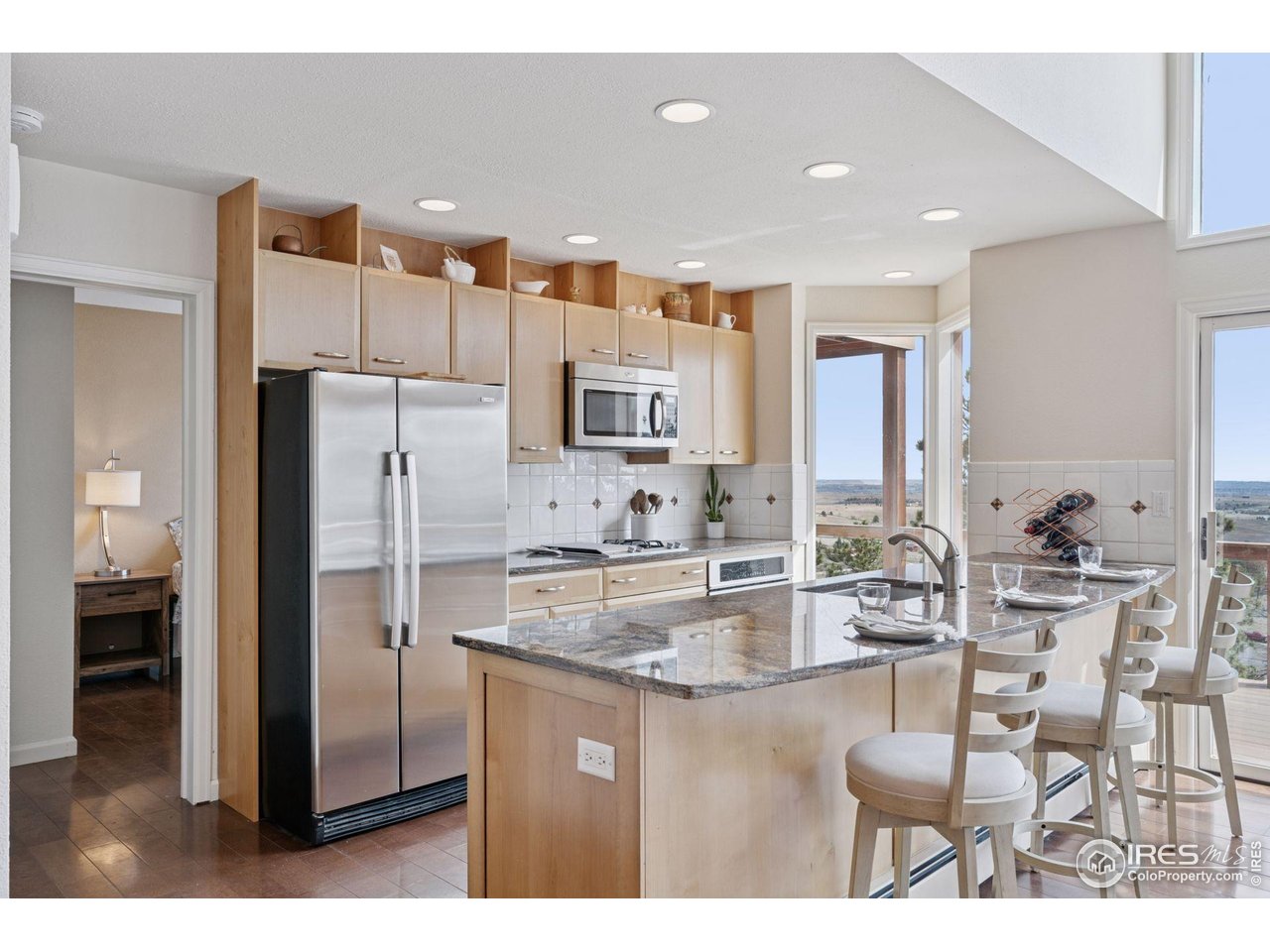 8654 Thunderhead Drive Boulder, CO 80302 - Photo 22 of 40 a kitchen with stainless steel appliances granite countertop a refrigerator and a stove