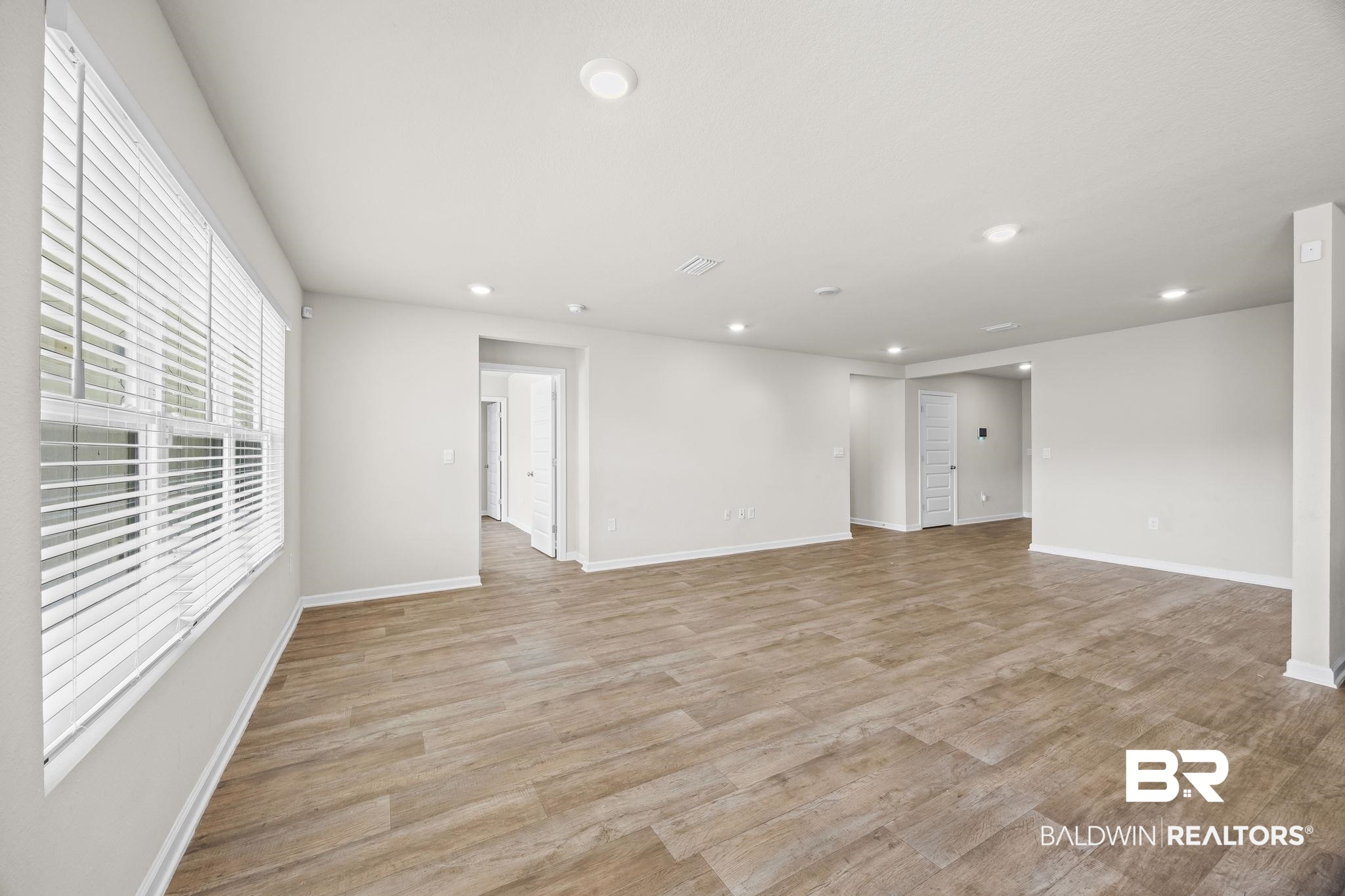 3090 Camino Real Loop Lillian, AL 36549 - Photo 11 of 29 Unfurnished room with light wood finished floors and recessed lighting