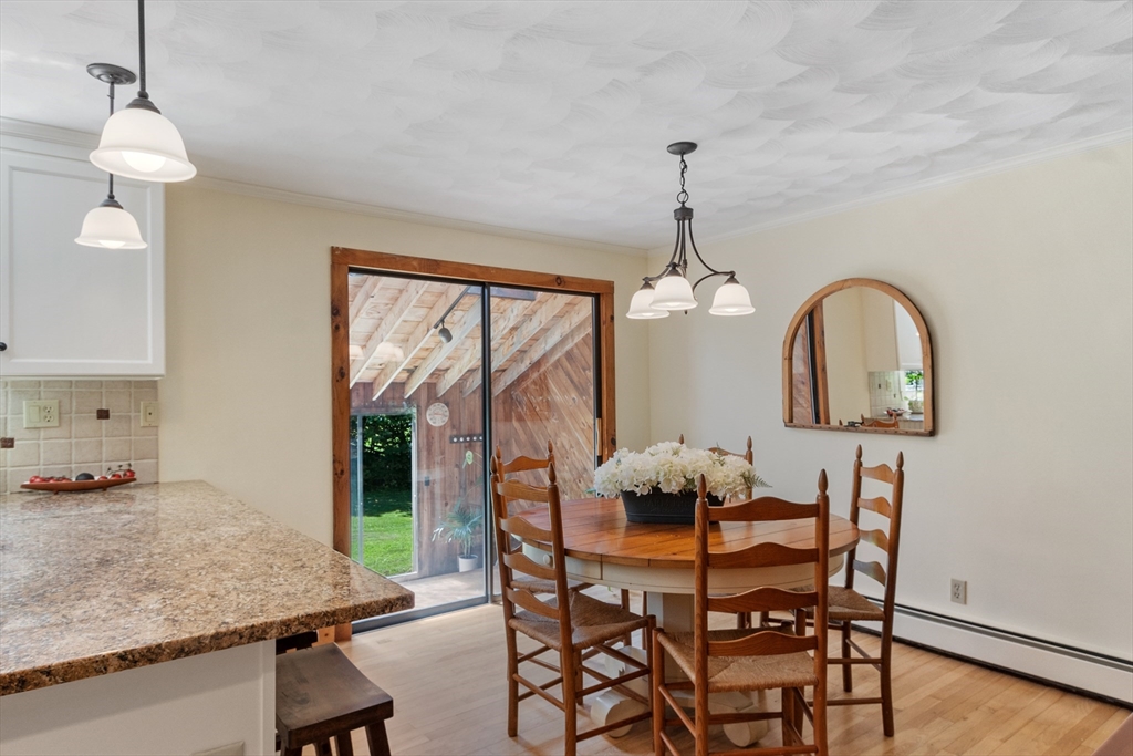 4 Prospect Hill Road Harvard, MA 01451 - Photo 12 of 37 a dining room with furniture a window and a chandelier